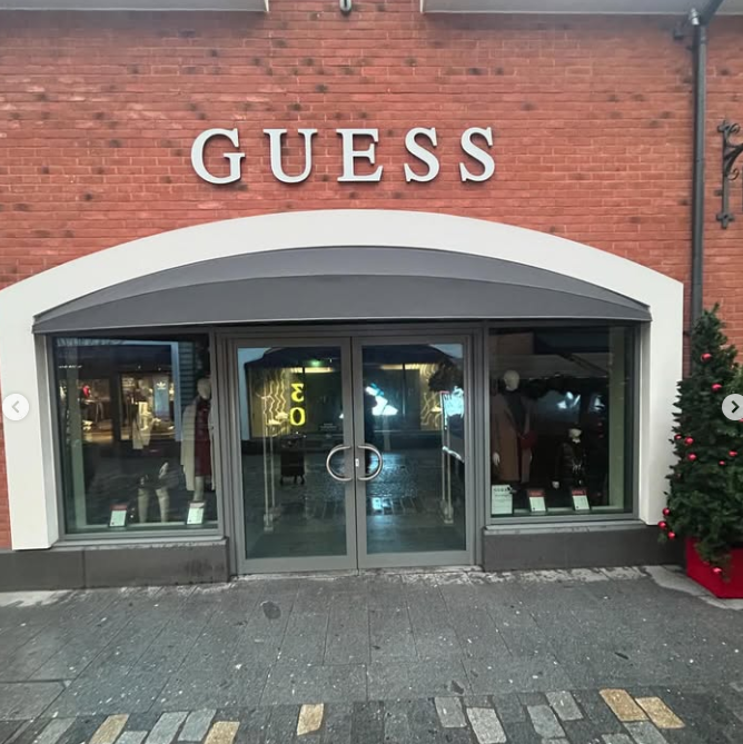 Shaped canopy installed at retail outlet